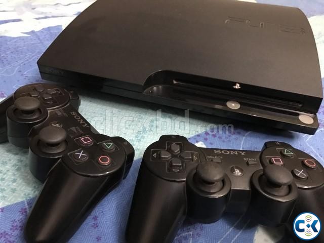 PS3 250 gb black with 2 controller and 7 original games large image 0