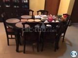 6 seater wooden with glass top dinning table.