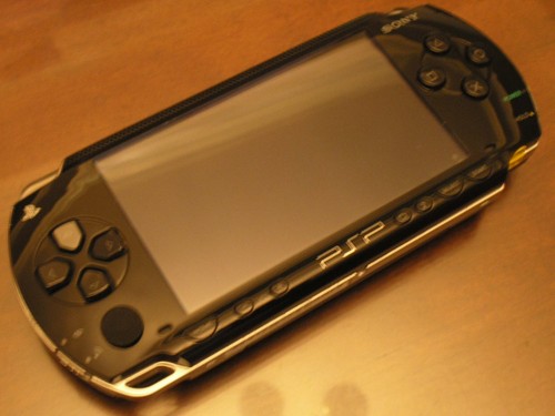 PSP Fat piano black 8 gb included.. cell no 01615698826 large image 0