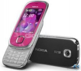 Nokia 7230 with Charger and Cover.