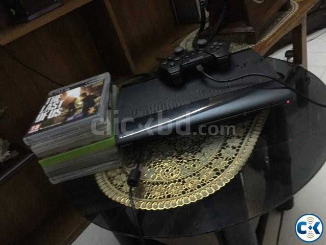 ps3 with some CDs large image 0