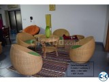 A set of cane chairs with big and small table
