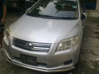 Toyota Axio 2007 model,,,2009 registration silver color CNG.