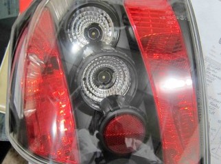 toyota runx alex 01-07 black housing tail light