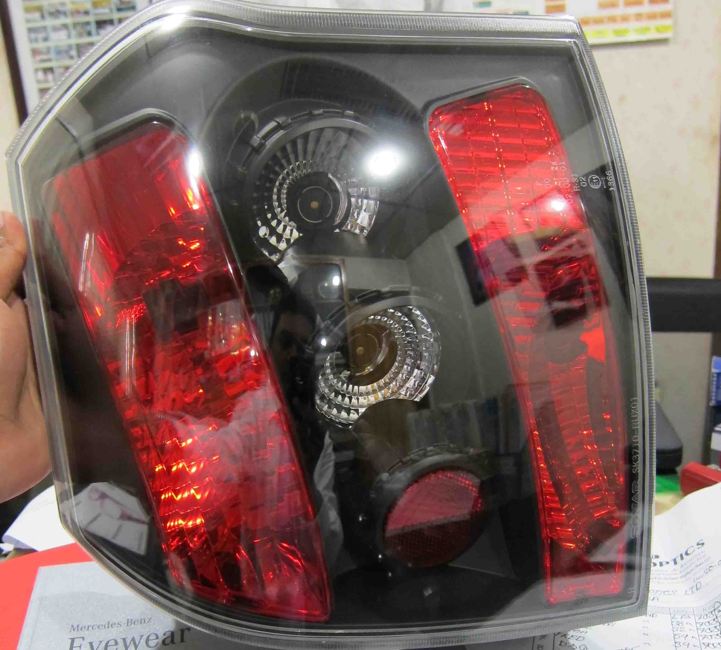 toyota runx alex 01-07 black housing tail light large image 1